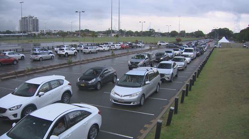 Cars wait at the Maroubra, Sydney COVID-19 testing centre.