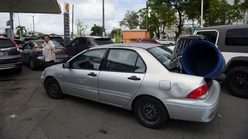 Drivers line up to fill up at a gas station one day before the forecasted arrival of Hurricane Maria in San Juan, Puerto Rico. (AP)