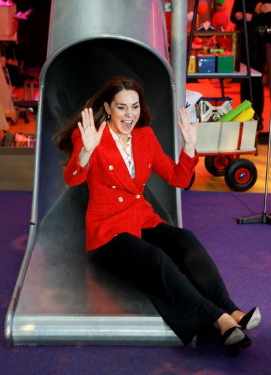 Kate Middleton, Duchess of Cambridge reacts as she slides down a slide during a visit at the LEGO Foundation PlayLab on February 22, 2022 in Copenhagen, Denmark