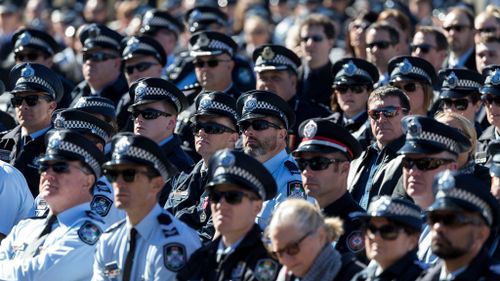 Officers pay their respects at Senior Constable Brett Forte's funeral. 