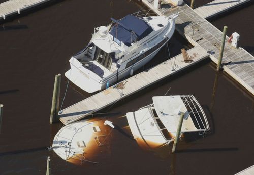 Boats are sunk and aground at Carolina Beach after the hurricane swept through.