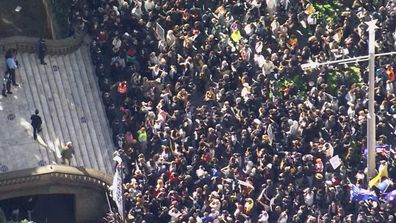 Thousands of lockdown protesters packed together outside Sydney Town Hall.