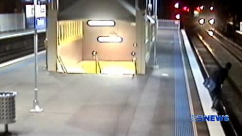 The man was captured on CCTV cameras jumping onto tracks at Banksia Station. (9NEWS)