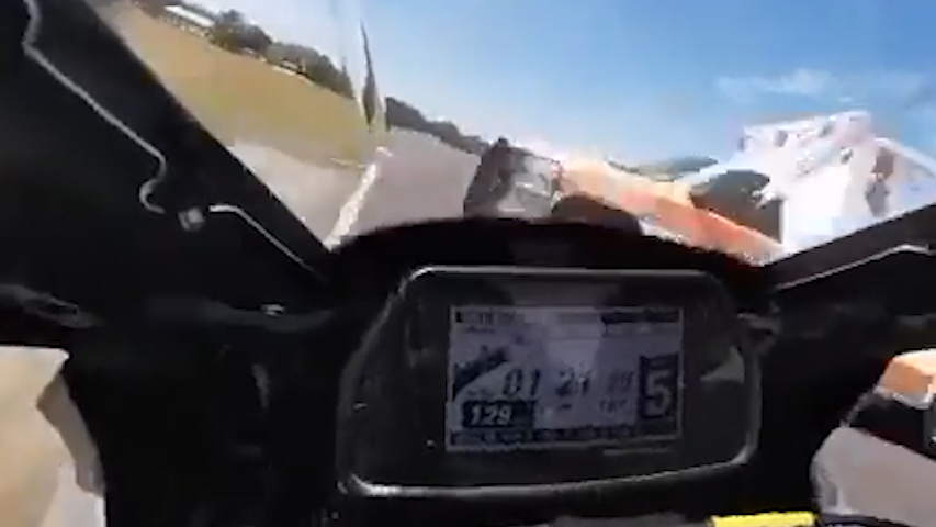 Daniel Alexander an amateur motorcycle racer in the US has survived a terrifying crash after an ambulance crossed a live track towards the end of a race.