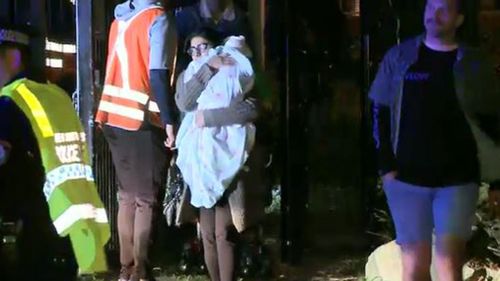 A train full of commuters was left stranded on the tracks as police surveyed the area. (9NEWS)