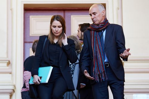 Quinn's lawyer Hannah MacDougall, with the accused's father outside of court.