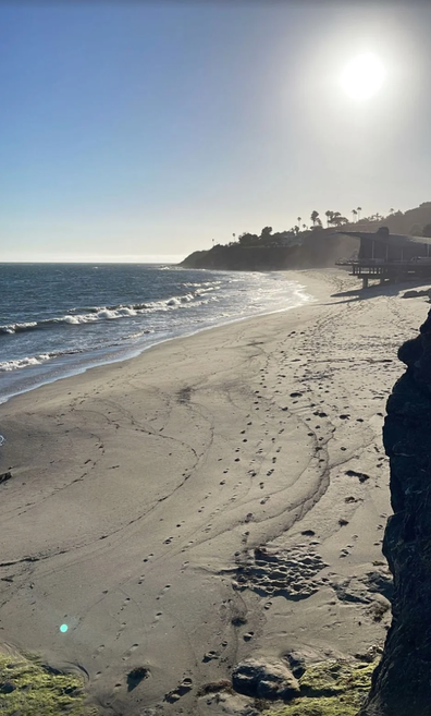 Travis Barker discharged from hospital after pancreatitis, enjoys beach with wife Kourtney Kardashian.