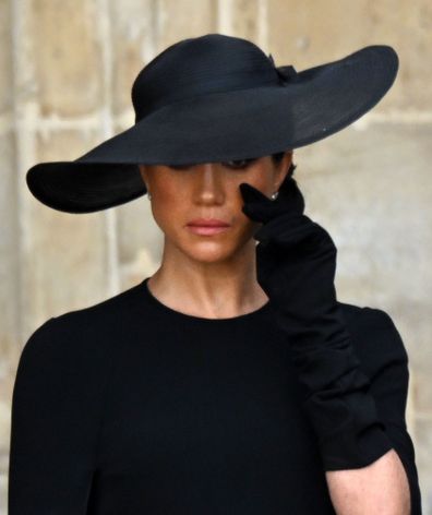 Meghan Markle, the Duchess of Sussex wipes a tear away as she attends The State Funeral of Her Majesty The Queen on 19 Sep 2022.
