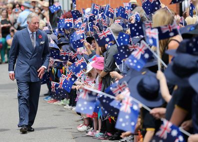 Schoolchildren wave Australian flags as Prince Charles, Prince of Wales visits Kilkenny Primary School on November 7, 2012 in Adelaide, Australia. The Royal couple are in Australia on the second leg of a Diamond Jubilee Tour taking in Papua New Guinea, Australia and New Zealand.