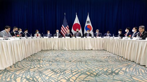 US Secretary of State Antony Blinken, centre,  participates in a trilateral meeting with South Korean Foreign Minister Park Jin, right, and Japanese Foreign Minister Yoshimasa Hayashi, left, during the G-20 Foreign Ministers Summit in Nusa Dua, on Indonesia's resort island of Bali Friday, July 8, 2022. (Stefani Reynolds/Pool Photo via AP)