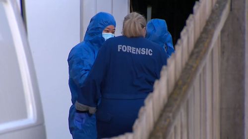 Homicide detectives have swarmed a Victorian street after a woman's body was discovered in a nearby waste facility.