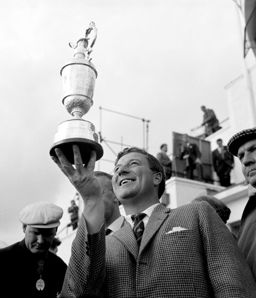 Thomson holds up his fifth and final Claret Jug. Picture: AAP