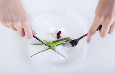 Person eating from almost empty plate