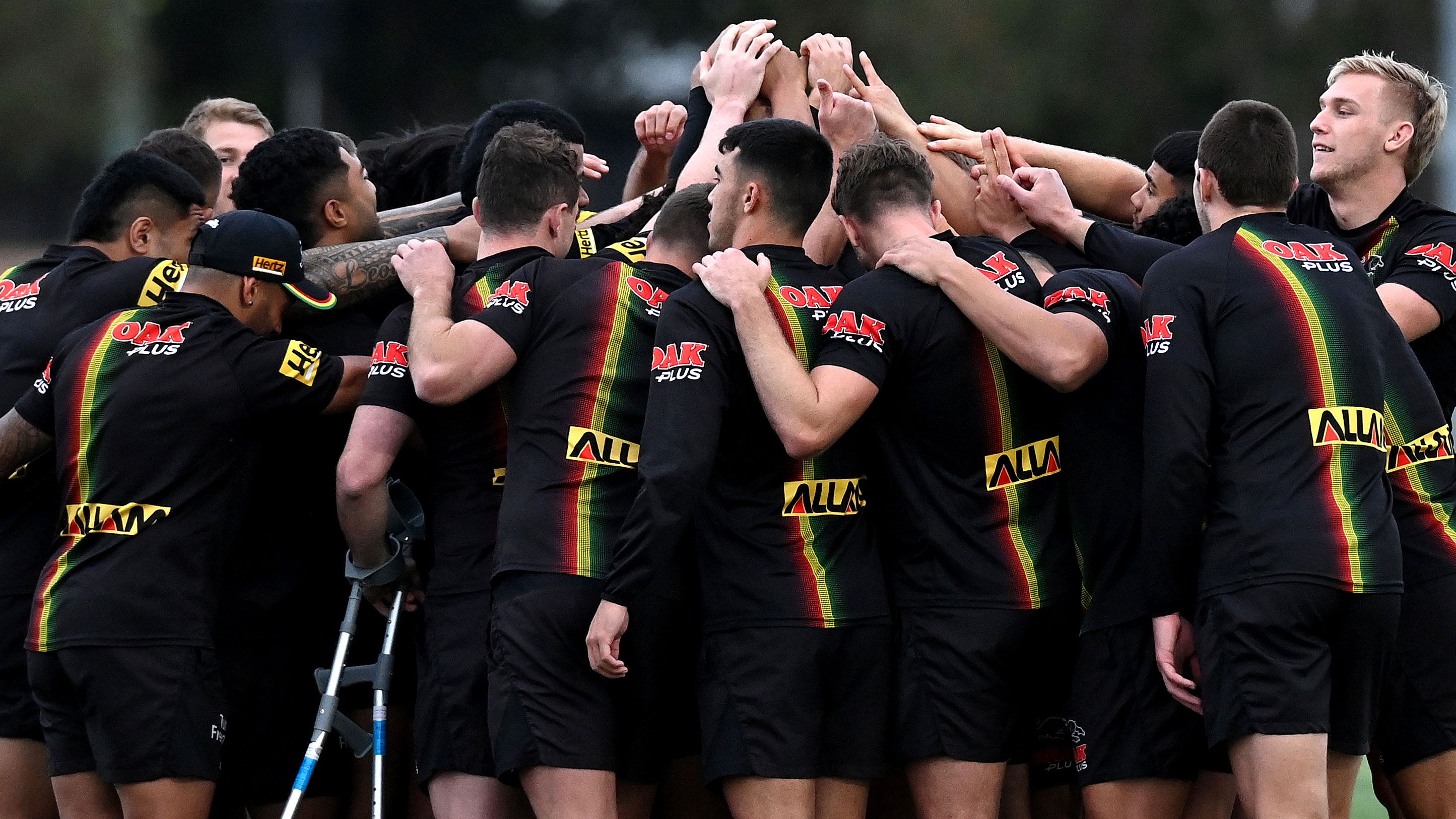 The players embrace during a Penrith Panthers training session at Sunshine Coast Stadium. 