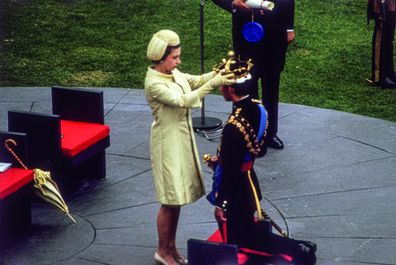 Queen Elizabeth II crowns her son Charles, Prince of Wales, during an investiture ceremony at Caernarvon Castle. July 1, 1969 (Photo by Hulton Archive/Getty Images)