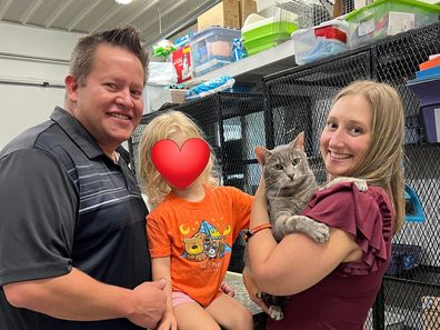 Barney the cat and his new family.