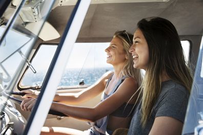 Two girls in a car on a road trip