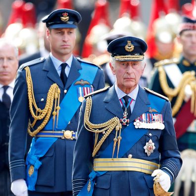 Prince William, Prince of Wales and King Charles III walk behind Queen Elizabeth II's coffin ahead of her Lying-in-State on September 14, 2022 in London, United Kingdom. 