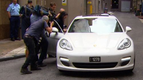 TV crews descend on Mehajer's friend's Porsche as he arrives to give him a ride home.