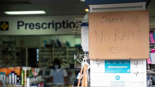 Posters for COVID-19 rapid antigen test, outside a pharmacy in Sydney.