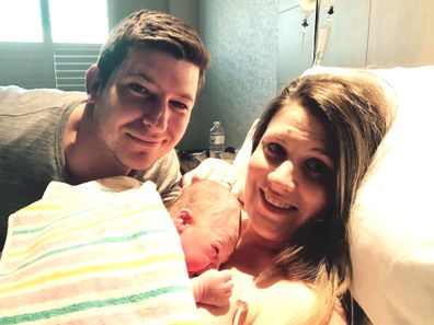 Craig Anderson with wife Bec and his newborn son. 