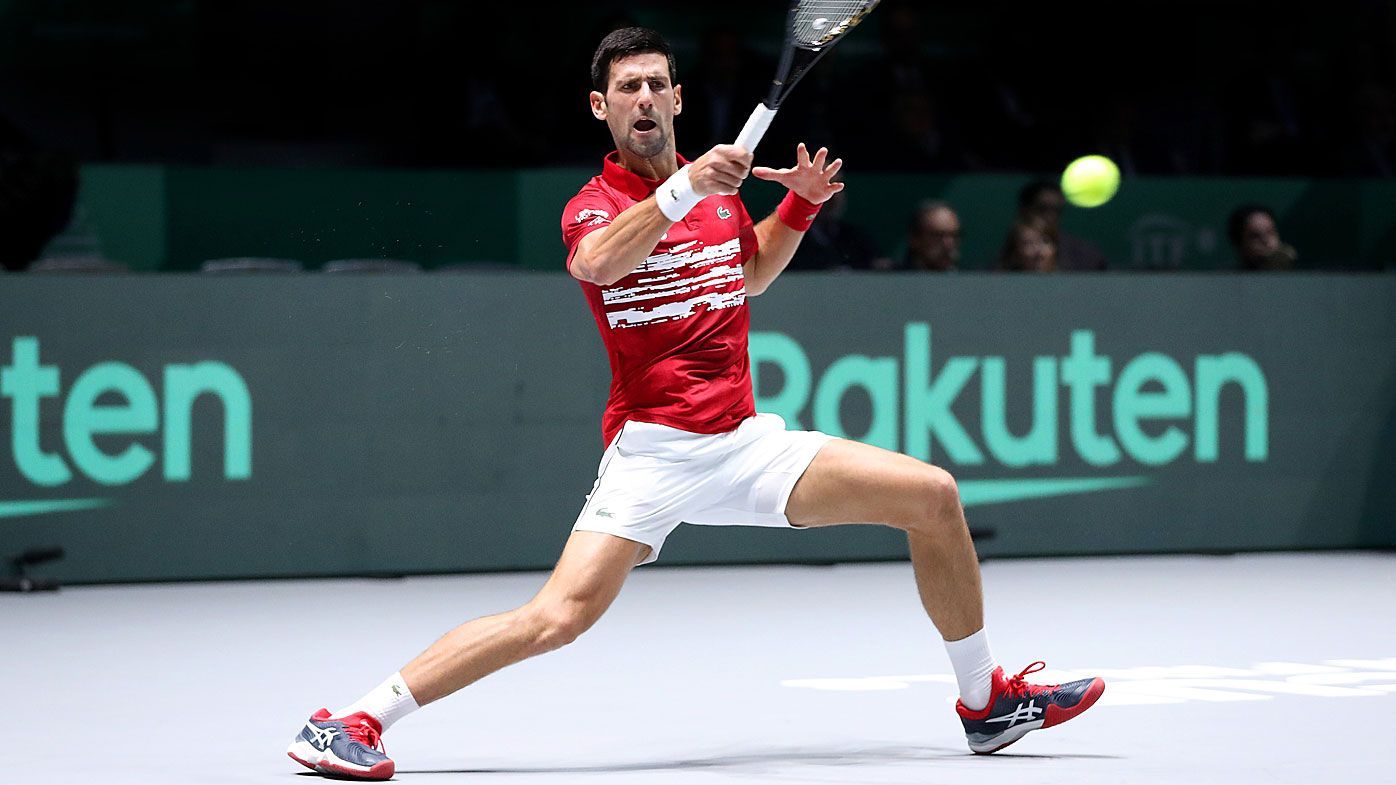 Novak Djokovic of Serbia plays a forehand shot during his Davis Cup group stage match against Yoshihito Nishioka 