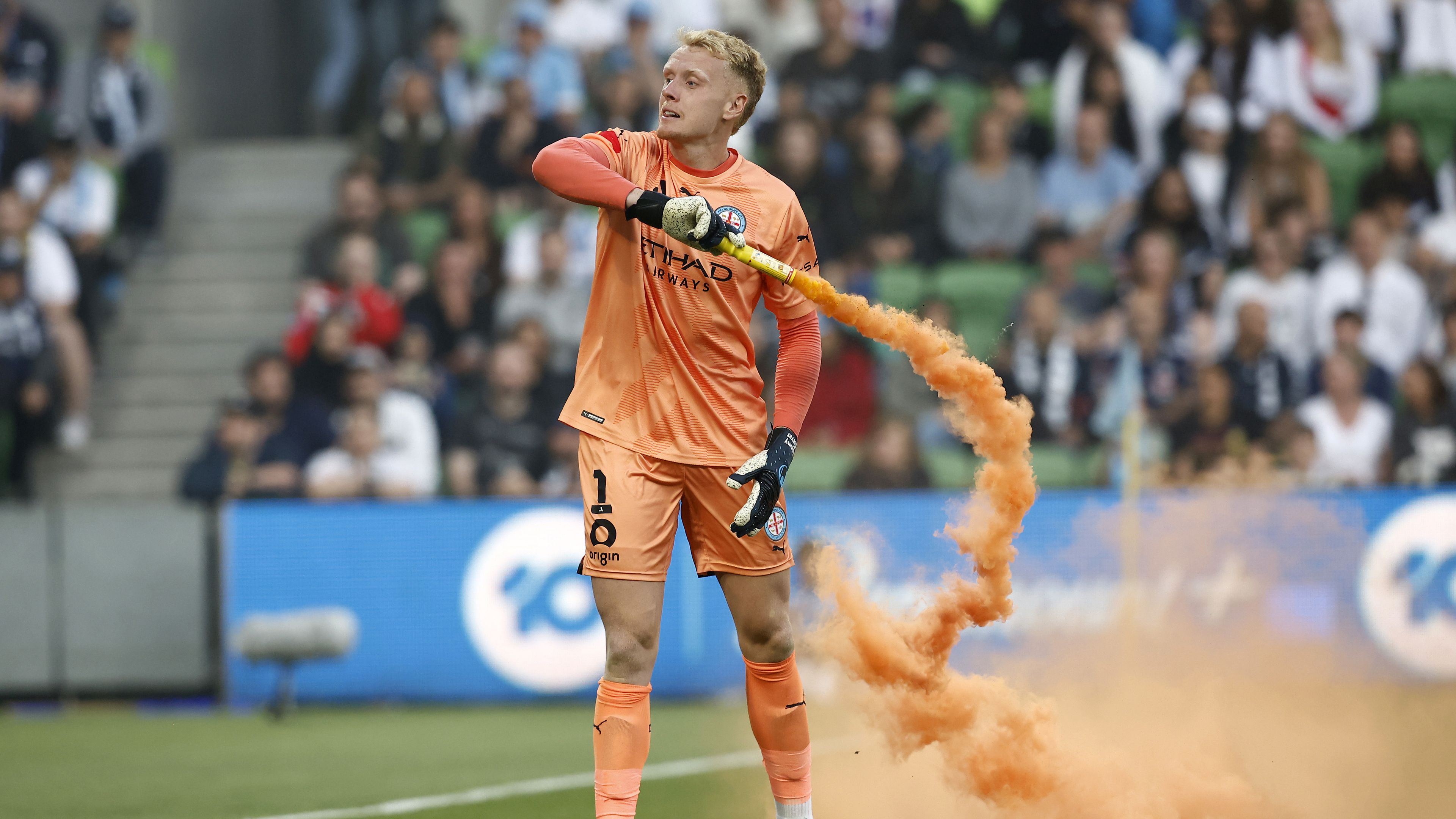 Melbourne City goalkeeper cleared over flare throw that ignited A-League pitch invasion
