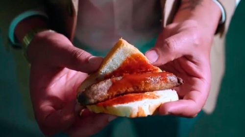 The add pokes fun at the humble sausage sandwich.