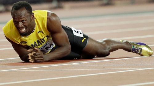 Usain Bolt fell to the ground after the injury. (AFP)