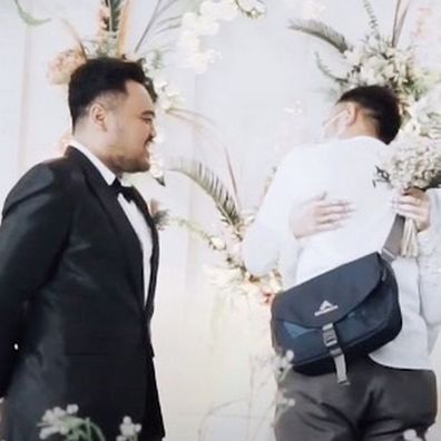 Groom winces as wife-to-be hugs ex-boyfriend 'one last time'