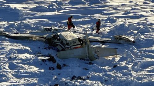 This photo provided by the U.S. Coast Guard on Friday, Feb. 7, 2025, shows a small commuter plane that crashed in western Alaska on a flight that was bound for the hub community of Nome. (U.S. Coast Guard via AP)This photo provided by the U.S. Coast Guard on Friday, Feb. 7, 2025, shows a small commuter plane that crashed in western Alaska on a flight that was bound for the hub community of Nome. (U.S. Coast Guard via AP)