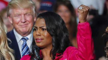 Donald Trump listens to Omarosa Manigault-Newman. (AAP)