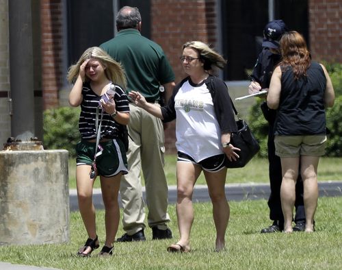 A pupil at Santa Fe High School bursts into tears after collecting her belongings from school. Picture: AP