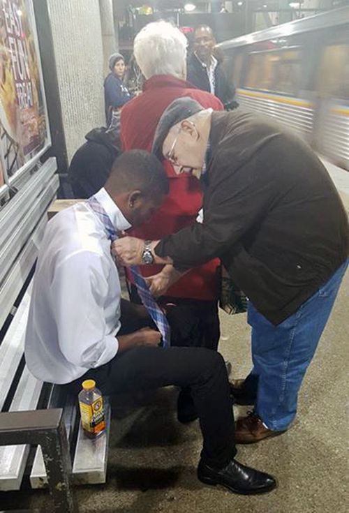 Viral photo shows elderly man teaching stranger how to tie a tie