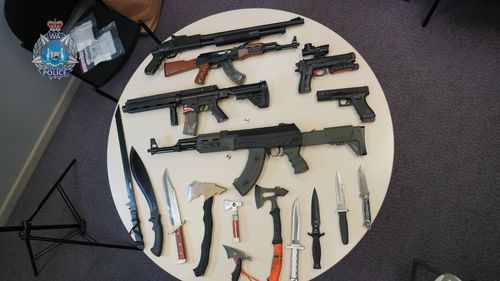 Nearly 20 illegal weapons have been seized from a home in Western Australia by police, including machetes and tasers. 