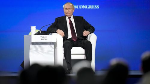 Russian President Vladimir Putin gestures attends a plenary session of the St. Petersburg International Economic Forum in St.Petersburg, Russia, Friday, June 17, 2022.  (AP Photo/Dmitri Lovetsky)