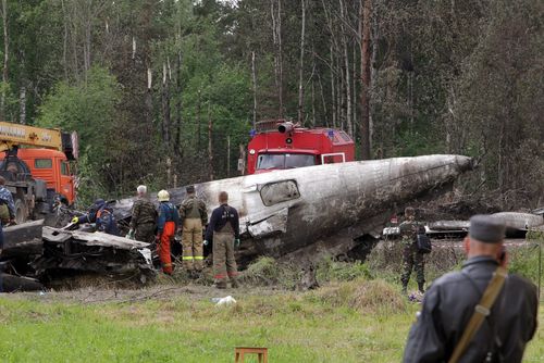 Russian emergency services and rescuers stand near debris of a Russian Tupolev-134 plane after it crashed near the airport of Petrozavodsk, Karelia province, Russia, 21 June 2011. Forty-four people died and eight survived when an airliner crashed overnight in north-western Russia, the Civil Defence Ministry said 21 June. The Russair charter flight from Moscow crashed about midnight (2000 GMT 20 June 2011) as it approached its destination of Petrozavodsk, 400km north-east of St Petersburg in Russia's Republic of Karelia, which borders Finland. The Tupolev Tu-134 with 43 passengers and a crew of nine on board made a hard landing on a highway about a kilometre from the airport at Petrozavodsk, the capital of Karelia, news reports said. EPA/ANATOLY MALTSEV