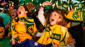 Australian fans celebrate as the Matildas beat Denmark