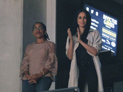 Meghan Markle, right, watches the closing ceremonies of the Invictus Games with her mother Doria Ragland in Toronto. Picture: AAP