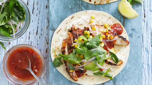 Smoky chargrilled chicken tortillas with grilled corn and herb salad
