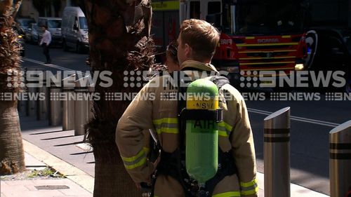 Specialist HAZMAT crews outside the building in Sydney's CBD.