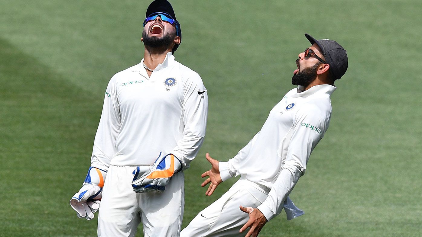 Pant and Kohli celebrate a wicket
