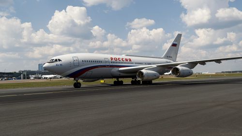 Mr Putin's jet was met by a waiting motorcade. Picture: EPA/AAP