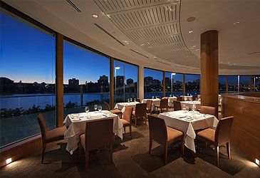 Which chef co-owns the Aria restaurants in Sydney and Brisbane with Bruce Solomon?