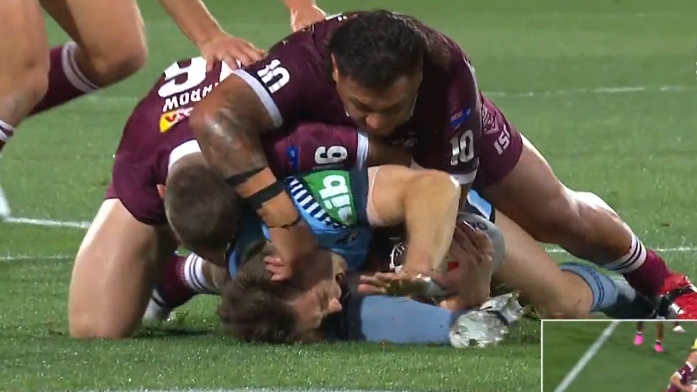 Cam Murray is injured in a tackle