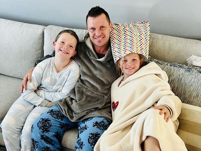 Charli Gerrey with her dad and little sister during cancer treatment.