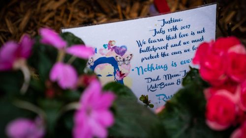 A memorial for Justine Ruszczyk Damond is seen near the alley where she was killed.