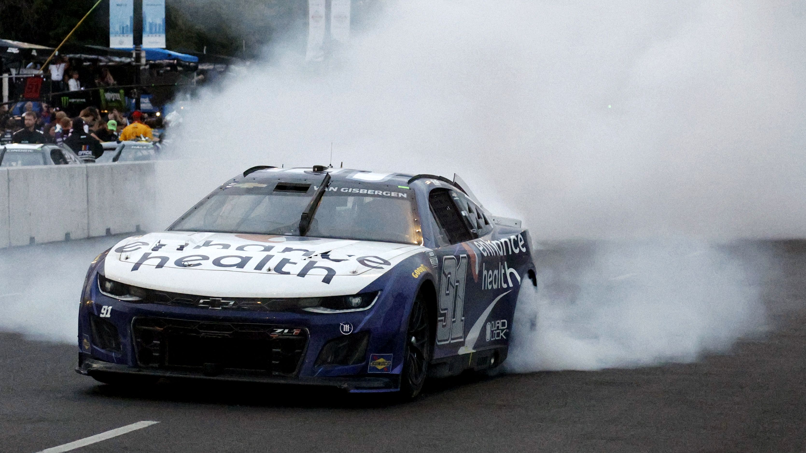 Shane Van Gisbergen, driver of the No.91 Chevrolet Camaro, celebrates with a burnout after winning the NASCAR Cup Series race at the Chicago Street Course.