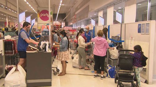 Keen shoppers lined up outside Kmart to wander the aisles and fill their trollies as the clock struck midnight. 