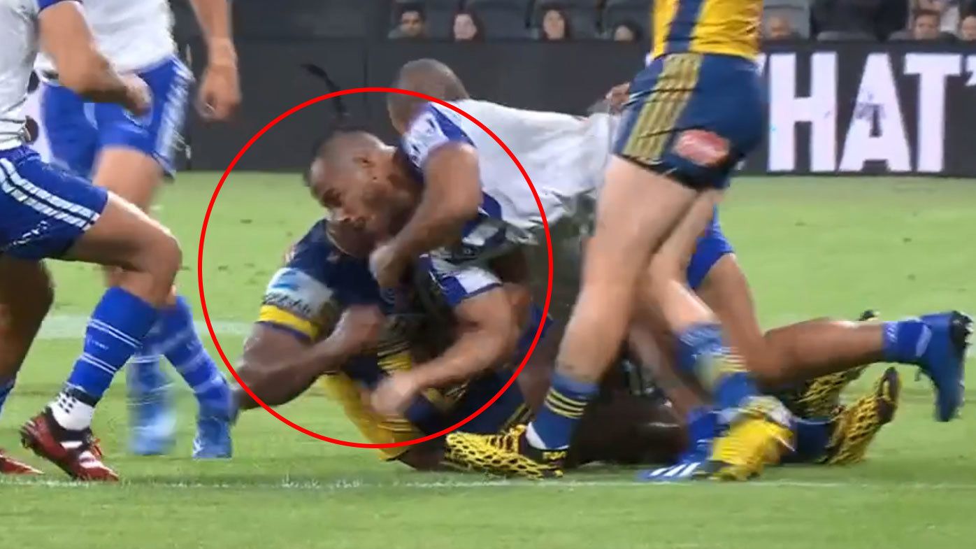 Crichton leads with a swinging arm on Sivo in the NRL season opener. (Nine)